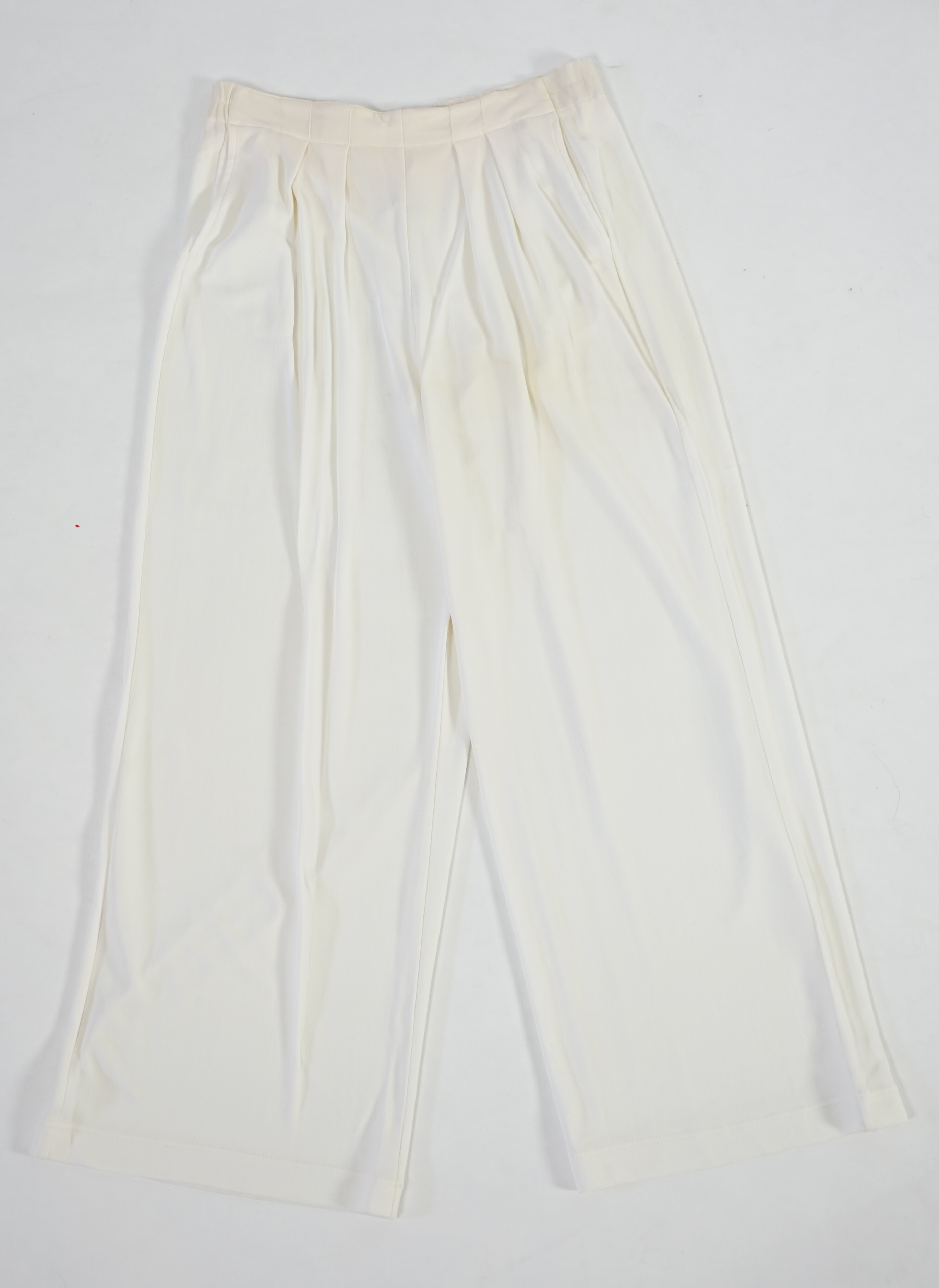 A La Perla white trouser lounge suit, a black jacket lounge jacket, a fawn silk dress and a white embroidered shirt dress. Approx Size L Proceeds to Happy Paws Puppy Rescue